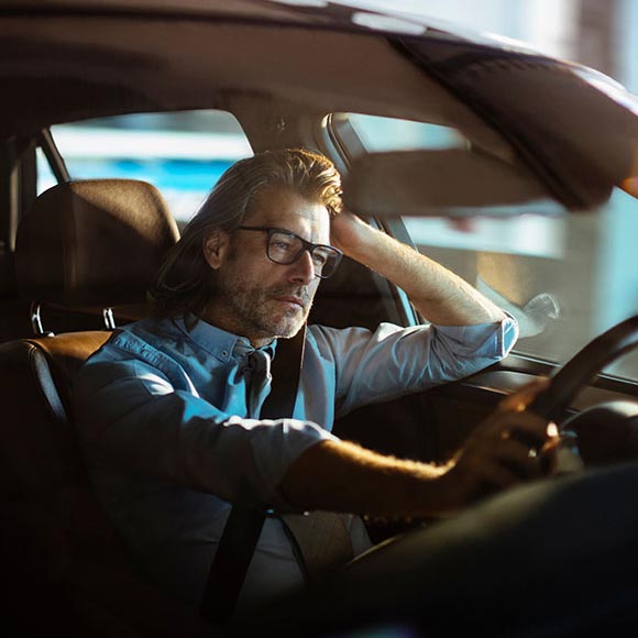 man being pulled over in car